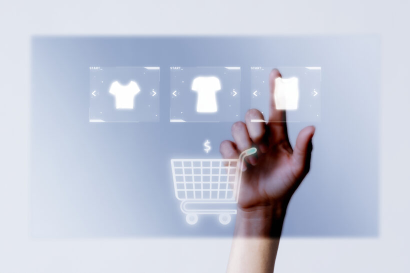 Person adding clothes to cart closeup for online shopping campai