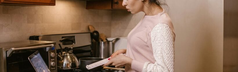 A person cooking in a kitchen, illustrating a virtual cooking class online fundraiser