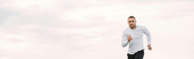 A person running outdoors, illustrating a virtual fitness challenge online fundraiser
