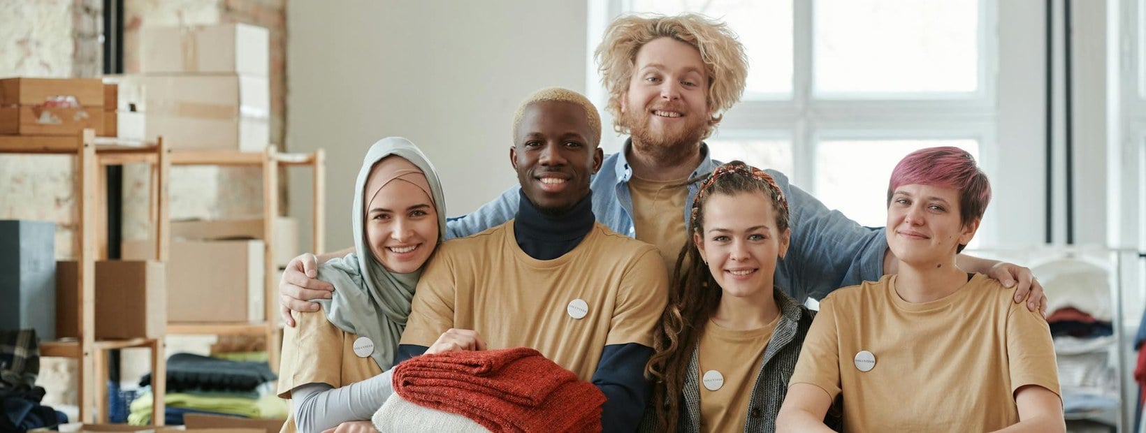WordPress donation plugins illustrated by a diverse team of smiling charity volunteers